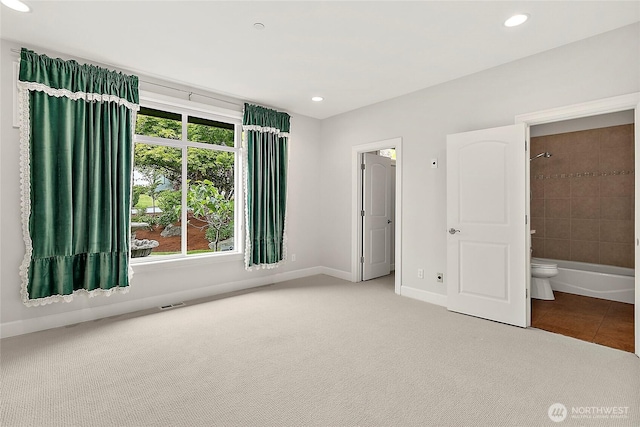 1038 Belfair Rd, Bellevue, WA 98004 - unfurnished bedroom with baseboards, carpet, recessed lighting, ensuite bath, and tile patterned flooring
