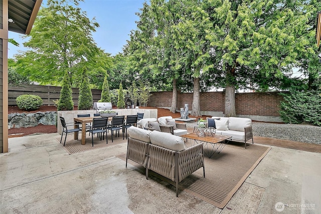 1038 Belfair Rd, Bellevue, WA 98004 - fenced backyard with an outdoor hangout area, outdoor dining area, and a patio area