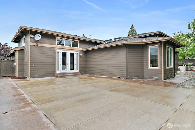 1038 Belfair Rd, Bellevue, WA 98004 - back of property with french doors, a patio area, and crawl space