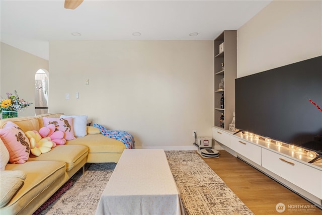 15623 NE 18th St Unit D201, Bellevue, WA 98008 - living room featuring light wood-type flooring and arched walkways