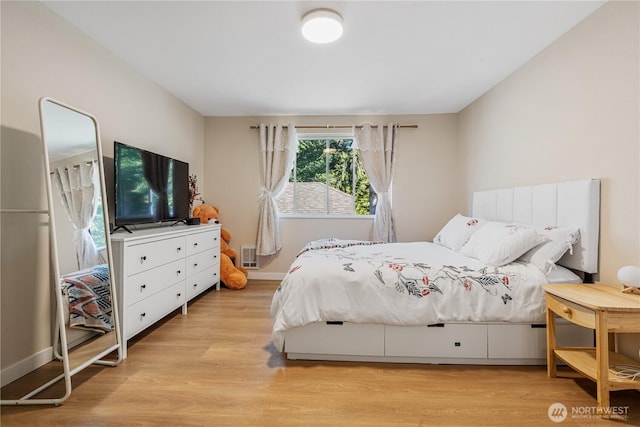 15623 NE 18th St Unit D201, Bellevue, WA 98008 - bedroom featuring light wood finished floors and baseboards