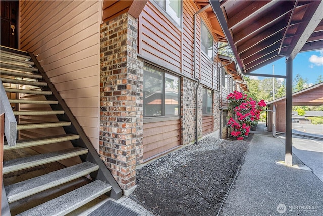 15623 NE 18th St Unit D201, Bellevue, WA 98008 - view of home's exterior featuring stairway and brick siding
