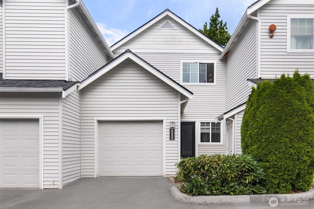 829 232nd Pl NE, Sammamish, WA 98074 - view of front of home featuring asphalt driveway and an attached garage
