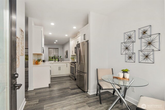 829 232nd Pl NE, Sammamish, WA 98074 - kitchen featuring appliances with stainless steel finishes, dark wood-style flooring, recessed lighting, light countertops, and white cabinets