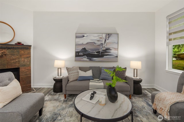 829 232nd Pl NE, Sammamish, WA 98074 - living area with wood finished floors, baseboards, and a fireplace