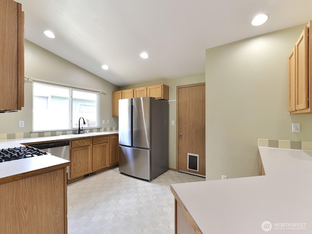 16312 72nd Ave E, Puyallup, WA 98375 - kitchen with freestanding refrigerator, light floors, a sink, lofted ceiling, and light countertops
