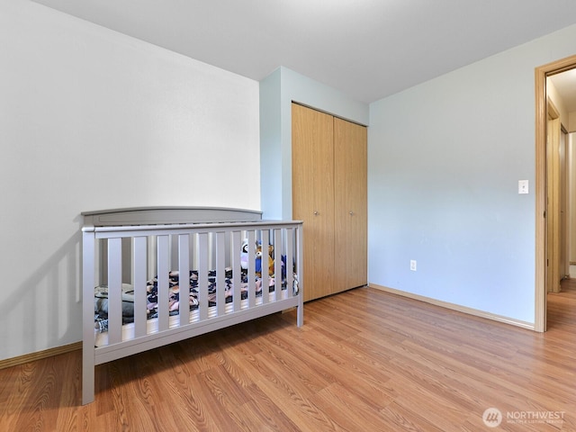 16312 72nd Ave E, Puyallup, WA 98375 - unfurnished bedroom featuring wood finished floors, baseboards, and a closet