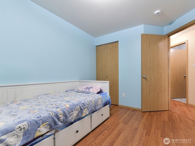 16312 72nd Ave E, Puyallup, WA 98375 - bedroom with light wood finished floors and a closet