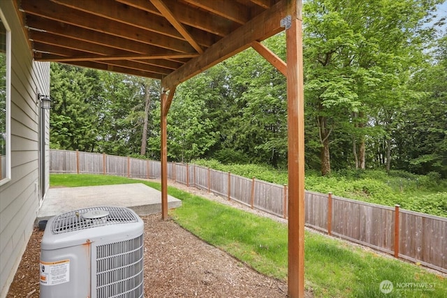 view of yard featuring central AC unit and a patio area