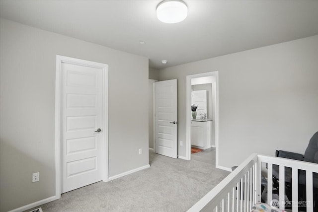 bedroom with carpet floors and baseboards