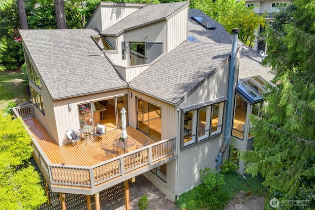11819 73rd Pl NE, Kirkland, WA 98034 - back of property featuring a shingled roof and a wooden deck