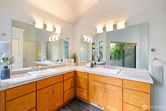 11819 73rd Pl NE, Kirkland, WA 98034 - bathroom featuring lofted ceiling, tile patterned flooring, and double vanity