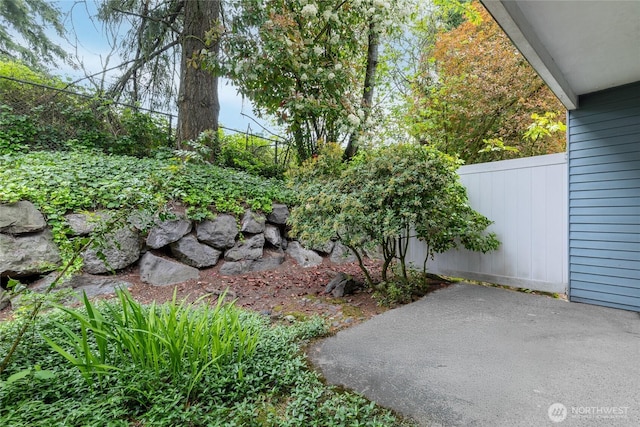 view of yard featuring a patio area and fence