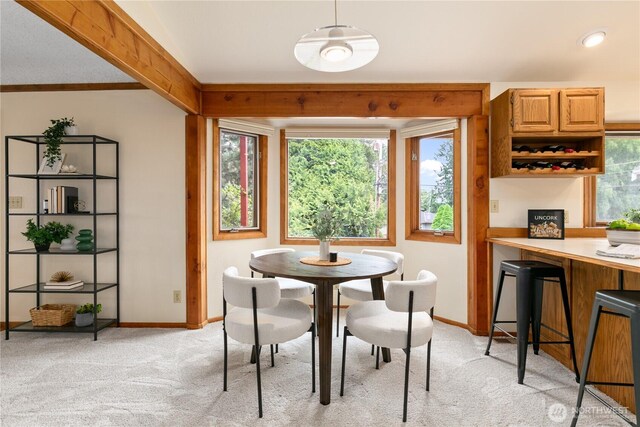 12013 Exeter Ave NE, Seattle, WA 98125 - dining room featuring light colored carpet and baseboards