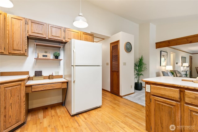 12013 Exeter Ave NE, Seattle, WA 98125 - kitchen with freestanding refrigerator, light wood-style floors, light countertops, lofted ceiling, and open shelves