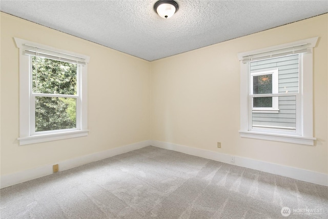 12013 Exeter Ave NE, Seattle, WA 98125 - carpeted empty room featuring a textured ceiling and baseboards