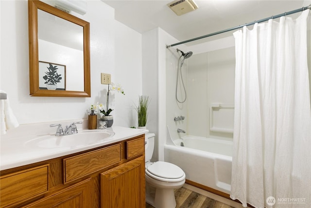 12013 Exeter Ave NE, Seattle, WA 98125 - bathroom featuring toilet, vanity, wood finished floors, and shower / bath combination with curtain