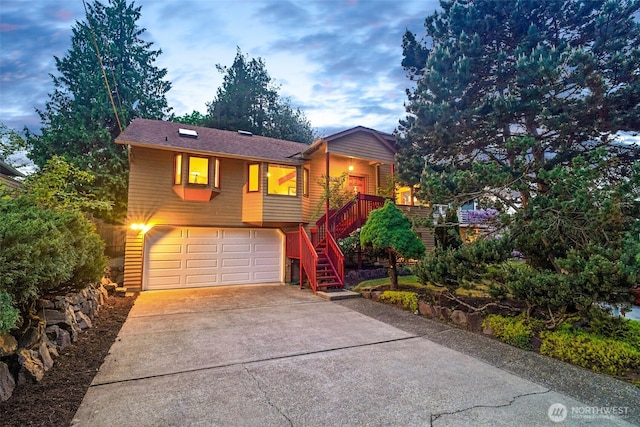 12013 Exeter Ave NE, Seattle, WA 98125 - view of front of home featuring driveway, a garage, and stairway