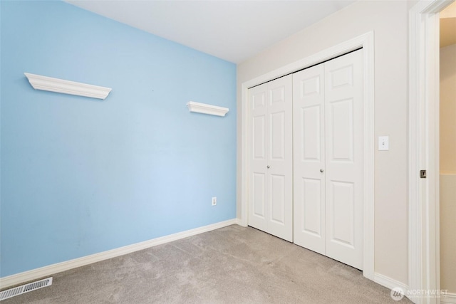 24045 40th Ln SE, Bothell, WA 98021 - unfurnished bedroom with carpet floors, a closet, and baseboards