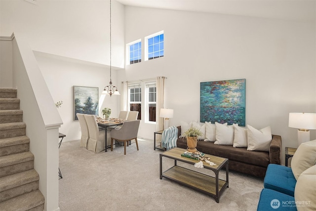 24521 SE 275th St, Maple Valley, WA 98038 - living area with stairway, carpet flooring, and high vaulted ceiling