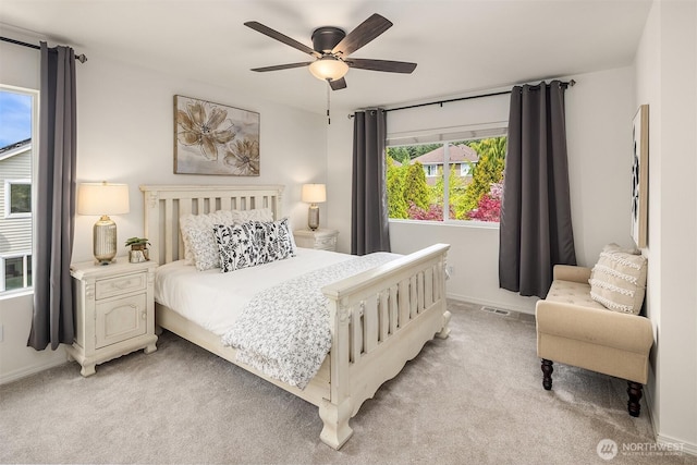 24521 SE 275th St, Maple Valley, WA 98038 - bedroom with light colored carpet, baseboards, and a ceiling fan