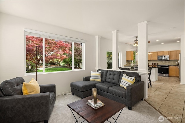 24521 SE 275th St, Maple Valley, WA 98038 - living room featuring decorative columns, ceiling fan, baseboards, recessed lighting, and light carpet