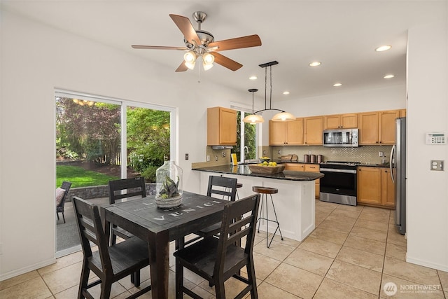 24521 SE 275th St, Maple Valley, WA 98038 - dining space with light tile patterned floors, a ceiling fan, and recessed lighting