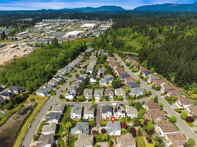 24521 SE 275th St, Maple Valley, WA 98038 - view of property location featuring a heavily wooded area, a mountain backdrop, and nearby suburban area