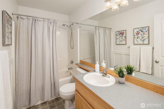 24521 SE 275th St, Maple Valley, WA 98038 - full bath with toilet, vanity, tile patterned floors, shower / tub combo, and a wainscoted wall