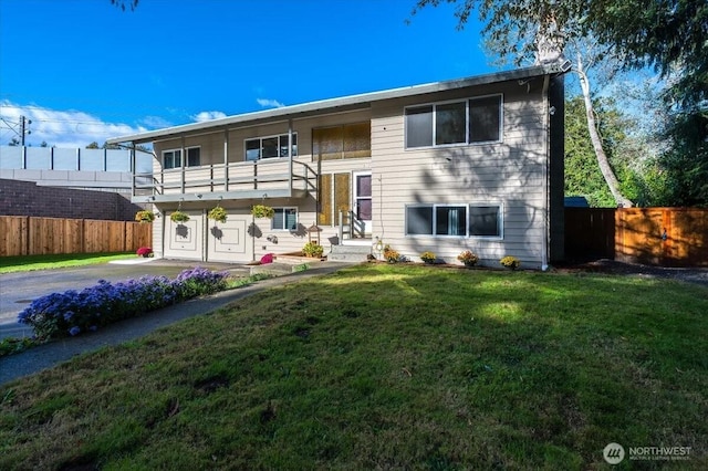 view of front of house with a balcony