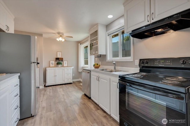 kitchen featuring stainless steel appliances, under cabinet range hood, white cabinets, a ceiling fan, and light wood finished floors