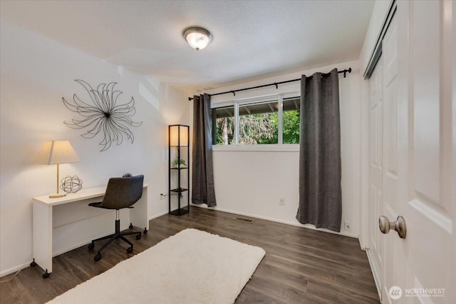 office space featuring dark wood-style floors and baseboards