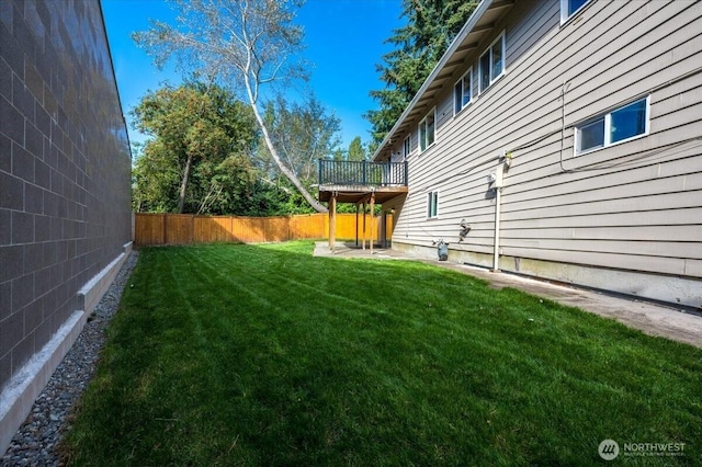 view of yard featuring a wooden deck
