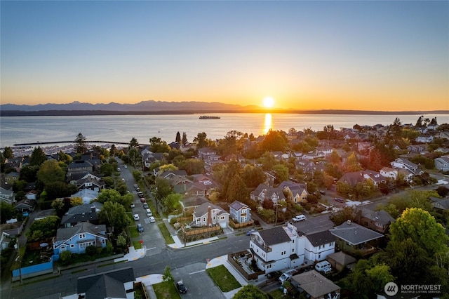 3202 NW 70th St, Seattle, WA 98117 - aerial overview of property's location featuring nearby suburban area and a water and mountain view