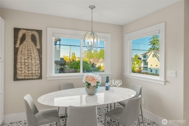3202 NW 70th St, Seattle, WA 98117 - dining area featuring baseboards and a chandelier