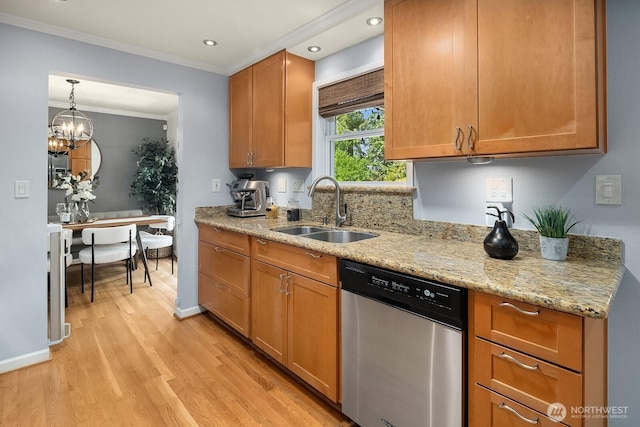 kitchen featuring stainless steel dishwasher, a sink, light wood finished floors, light stone counters, and ornamental molding