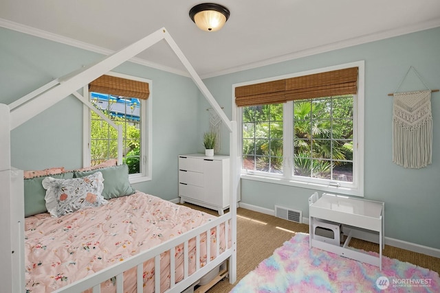 bedroom featuring ornamental molding, carpet floors, and baseboards