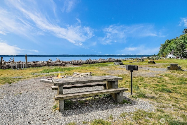 surrounding community with a water view
