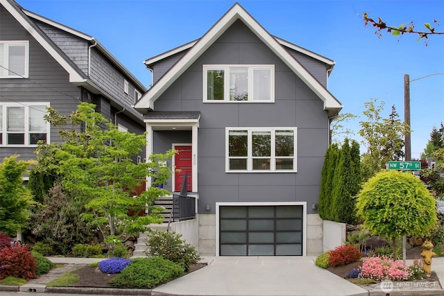 view of front of home featuring an attached garage, driveway, and stucco siding