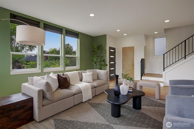 living area with recessed lighting and stairway