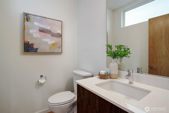 half bath with toilet and vanity