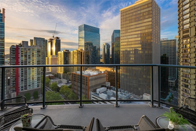 balcony featuring a skyline view