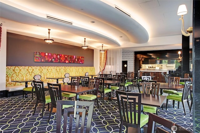 dining area with wallpapered walls and carpet flooring