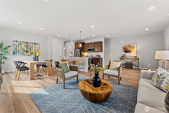81 E Compass Ln, Allyn, WA 98524 - living area with baseboards, light wood-style flooring, and recessed lighting