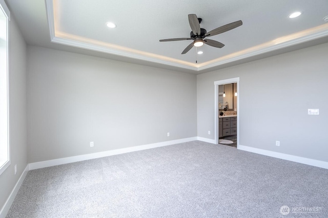 1196 8th Ave NE, Ephrata, WA 98823 - spare room with a tray ceiling, carpet floors, recessed lighting, a ceiling fan, and baseboards