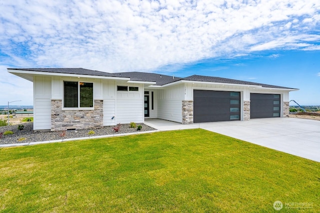 1196 8th Ave NE, Ephrata, WA 98823 - prairie-style home featuring stone siding, board and batten siding, an attached garage, and driveway