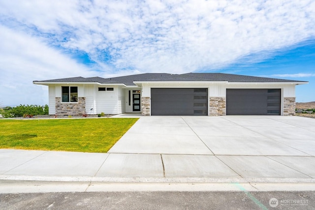 1196 8th Ave NE, Ephrata, WA 98823 - prairie-style house featuring stone siding, an attached garage, board and batten siding, driveway, and a front lawn