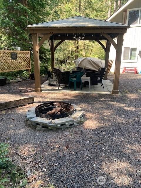 411 N Duckabush Dr E, Hoodsport, WA 98548 - view of yard featuring a gazebo, a fire pit, and a patio