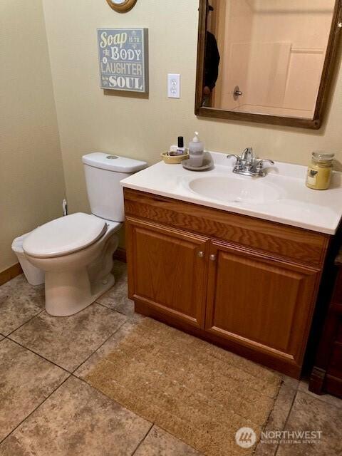 411 N Duckabush Dr E, Hoodsport, WA 98548 - bathroom featuring vanity, toilet, and tile patterned flooring
