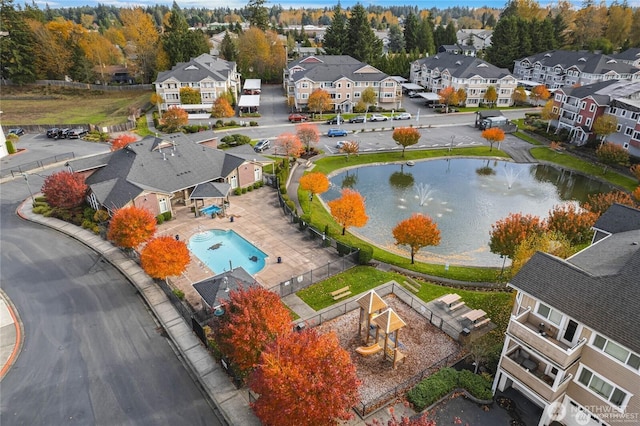 13405 97th Ave E Unit 107, Puyallup, WA 98373 - aerial perspective of suburban area featuring a large body of water and a pool